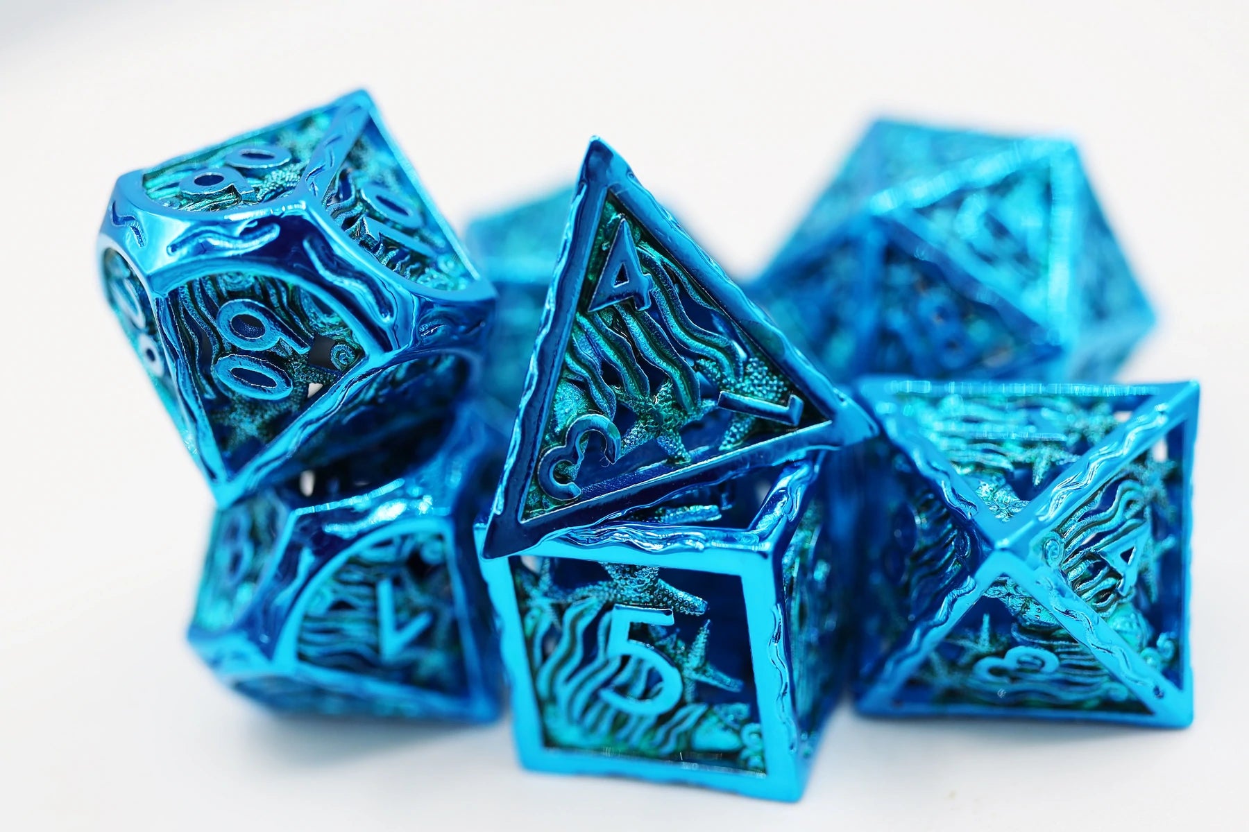 Seascape: Electro Blue Hollow Metal RPG Dice Set | Game Grid - Logan