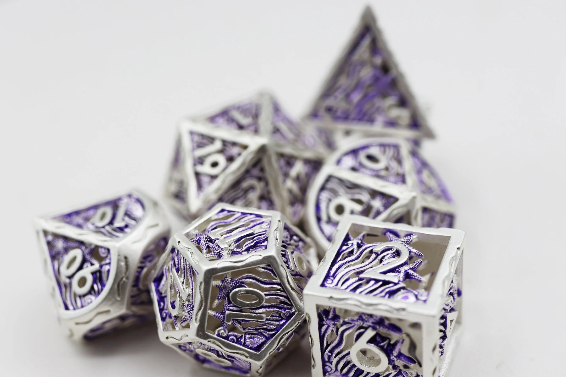 Seascape: Silver and Purple Hollow Metal RPG Dice Set | Game Grid - Logan