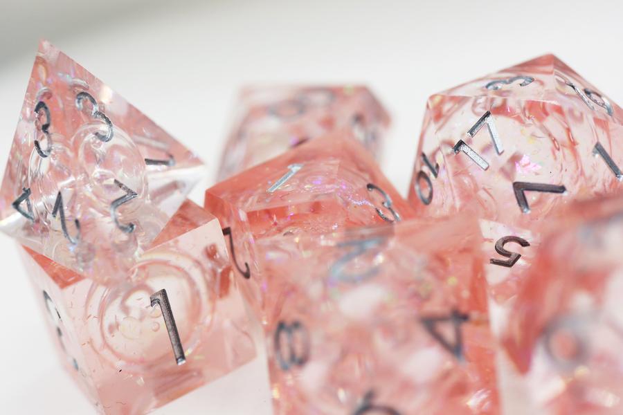Pink Liquid Core Sharp Edge Resin RPG Dice Set | Game Grid - Logan