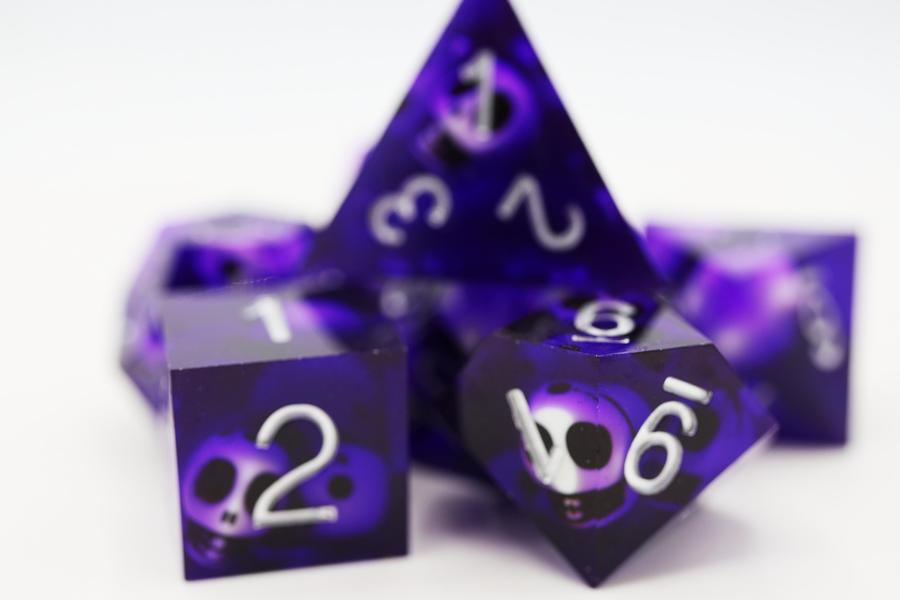 Sharp Edge Resin RPG Dice Set - Purple Skulls | Game Grid - Logan